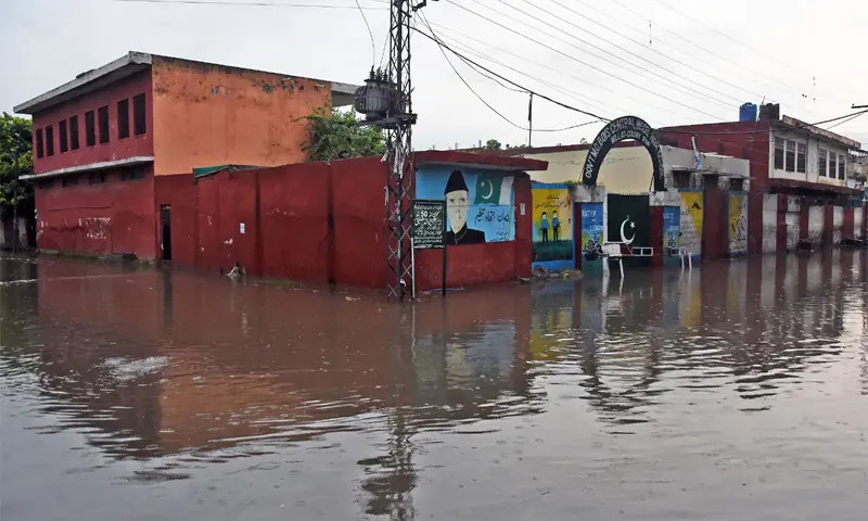 Rainwater accumulates in front of Government Boys School in Rawalpindi&rsquo;s Millat Colony following heavy rain on Monday. &mdash; Online