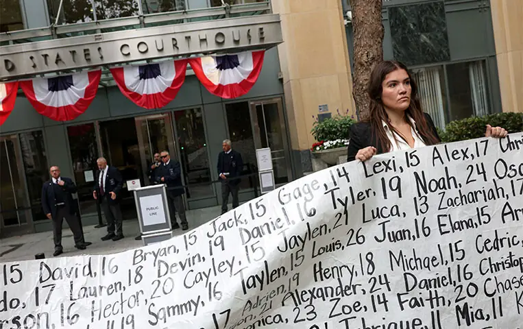 A woman holds a placard with names of children and young adults, whose deaths were related to social media use, as Meta faces a landmark trial in federal court in Oakland, California.—Reuters A woman holds a placard with names of children and young adults, whose deaths were related to social media use, as Meta faces a landmark trial in federal court in Oakland, California.—Reuters