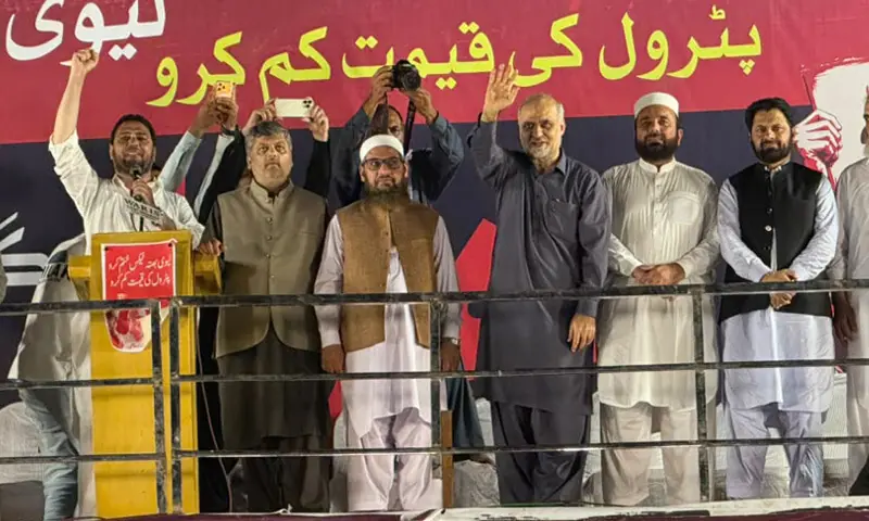Jamaat-i-Islami chief Hafiz Naeemur Rehman and other leaders wave to party supporters during the protest outside the Governor&rsquo;s House in Peshawar on Wednesday. &mdash; White Star