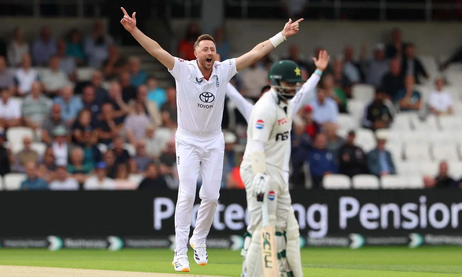 England’s Ollie Robinson (L) celebrates after taking the wicket of Pakistan’s Azan Awais on the opening day of the first Test match between England and Pakistan at Headingley cricket ground in Leeds, northern England on August 19, 2026. — AFP
