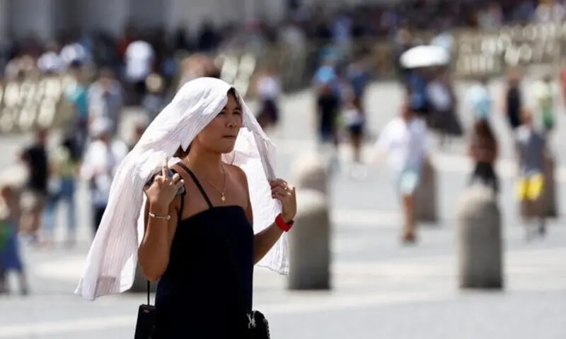 A woman walks in Vatican City during a heatwave across Italy, July 19, 2023. — Reuters A woman walks in Vatican City during a heatwave across Italy, July 19, 2023. — Reuters