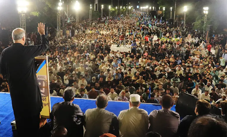 JI chief Hafiz Naeem ur Rehman speaks to participants of the sit-in near Governor House in Karachi, on Friday.—Dawn JI chief Hafiz Naeem ur Rehman speaks to participants of the sit-in near Governor House in Karachi, on Friday.—Dawn