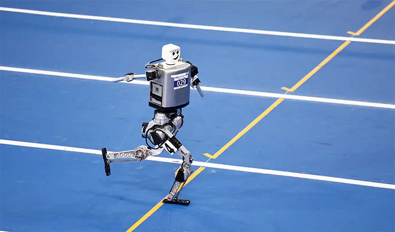 THE humanoid robot competes at a 100m preliminary race in Beijing.—Reuters THE humanoid robot competes at a 100m preliminary race in Beijing.—Reuters