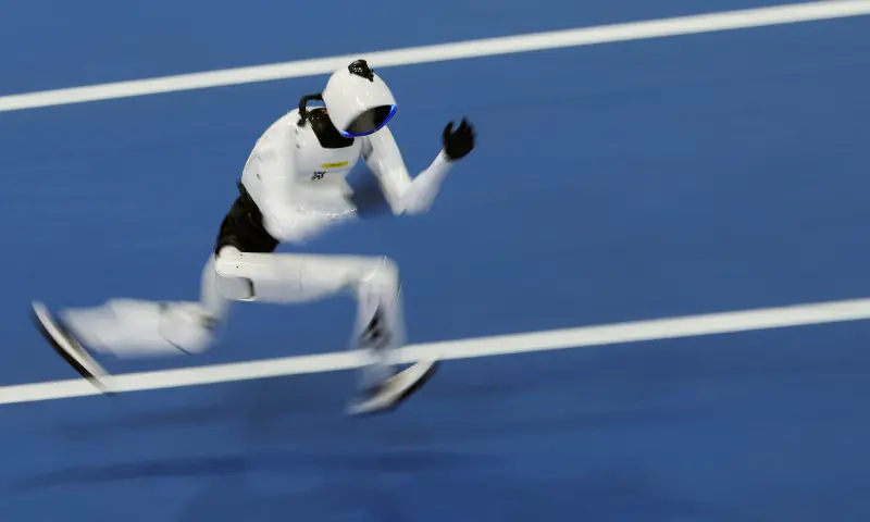 A Tiangong Omni humanoid robot competes in a 400m small-size group race, during the second World Humanoid Robot Games at the National Speed Skating Oval in Beijing, China on August 23, 2026. &mdash; Reuters
