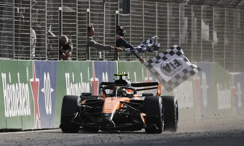 McLaren’s driver Lando Norris of Britain crosses the finish line to win the Formula One Dutch Grand Prix at Circuit Zandvoort on Sunday.—Reuters McLaren’s driver Lando Norris of Britain crosses the finish line to win the Formula One Dutch Grand Prix at Circuit Zandvoort on Sunday.—Reuters