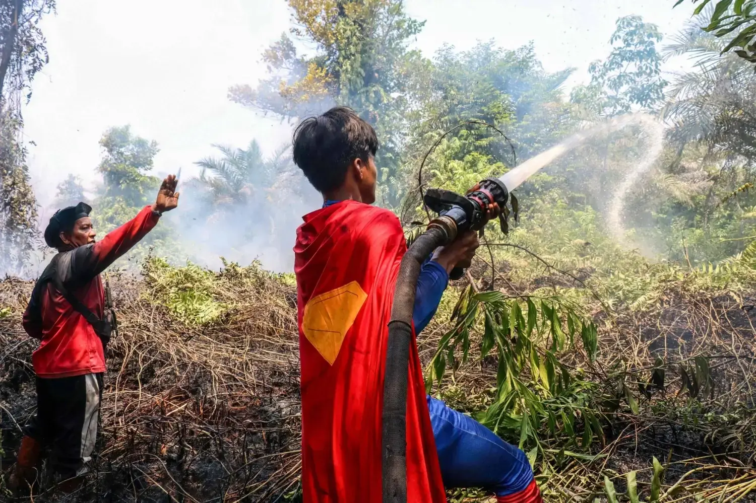 Indonesian teenage &lsquo;Superman&rsquo; joins wildfire fight in Borneo