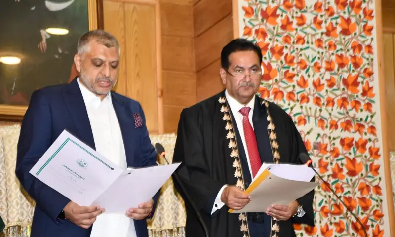 Speaker Chaudhry Tariq Farooq administers oath to Deputy Speaker Ahmed Raza Qadri during a session of the AJK Legislative Assembly, in Muzaffarabad on Aug 25. — photo via author Speaker Chaudhry Tariq Farooq administers oath to Deputy Speaker Ahmed Raza Qadri during a session of the AJK Legislative Assembly, in Muzaffarabad on Aug 25. — photo via author