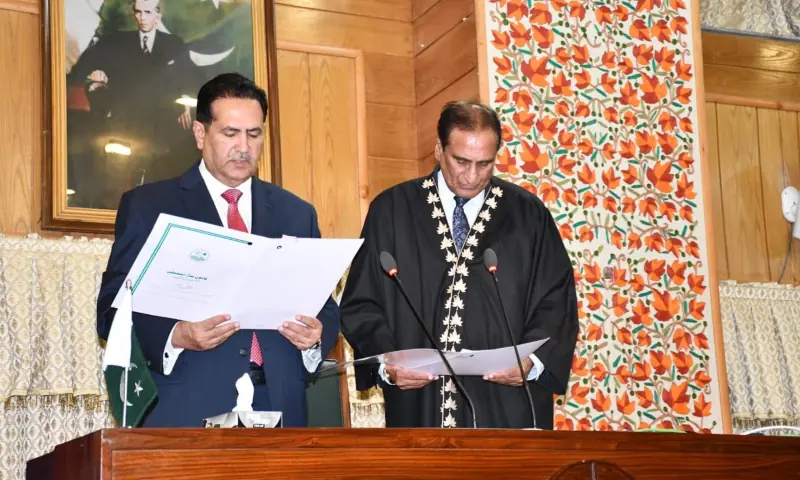 Outgoing speaker Chaudhry Latif Akbar (right) administers the oath to his successor Chaudhry Tariq Farooq during a session of the AJK Legislative Assembly, in Muzaffarabad on Aug 25. — photo via author Outgoing speaker Chaudhry Latif Akbar (right) administers the oath to his successor Chaudhry Tariq Farooq during a session of the AJK Legislative Assembly, in Muzaffarabad on Aug 25. — photo via author