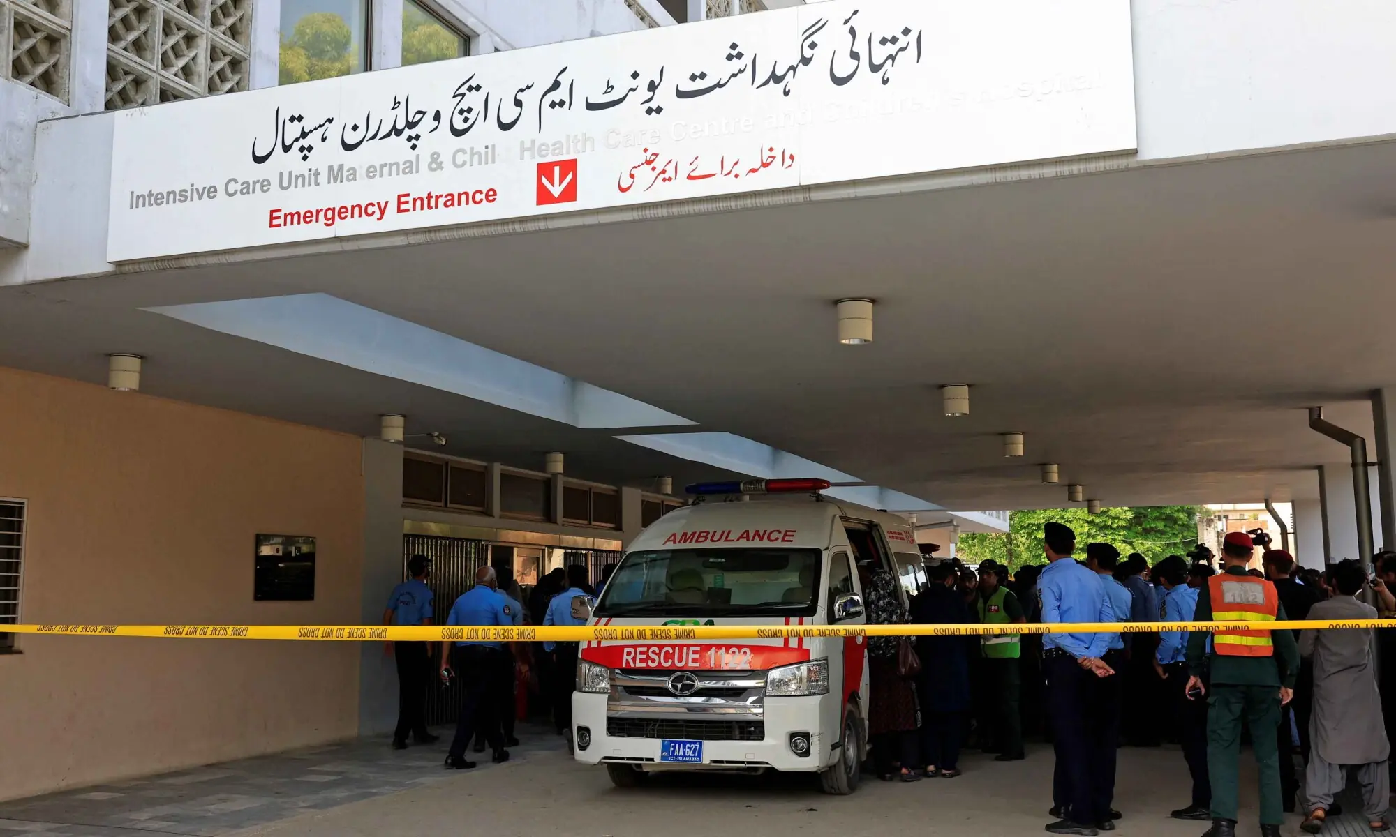 Police officers move past an ambulance outside an intensive care unit after a fire broke out at the Pakistan Institute of Medical Sciences hospital in Islamabad, on August 26, 2026. &mdash; Reuters