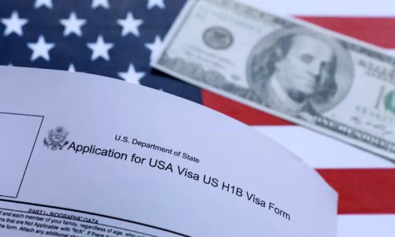 US flag, 100 dollar banknote and H-1B visa application form are seen in this illustration taken September 26, 2025. — Reuters/ File US flag, 100 dollar banknote and H-1B visa application form are seen in this illustration taken September 26, 2025. — Reuters/ File