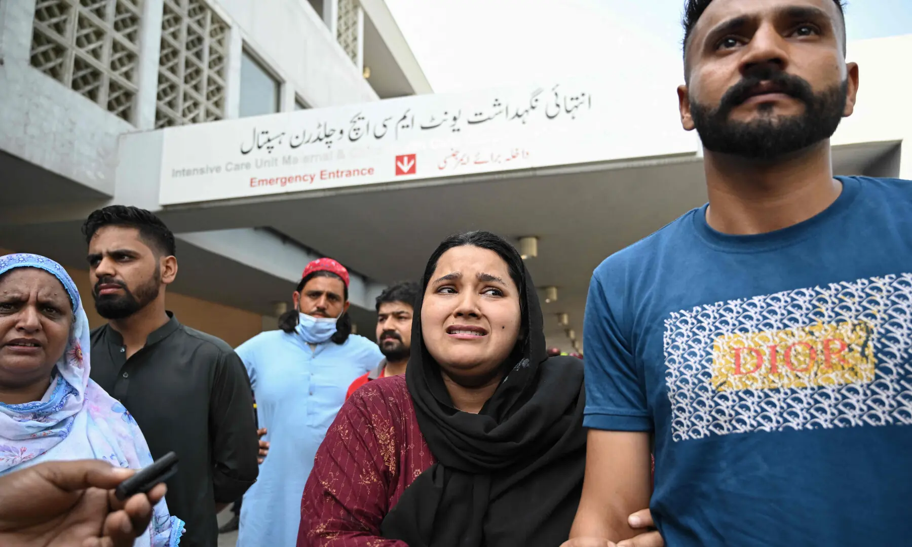 Jaweria (2nd R), who said she lost her child in the fire, reacts following the blaze at the Mother and Child Health (MCH) ward of the Pakistan Institute of Medical Sciences (Pims) in Islamabad on Aug 26, 2026. &mdash; AFP