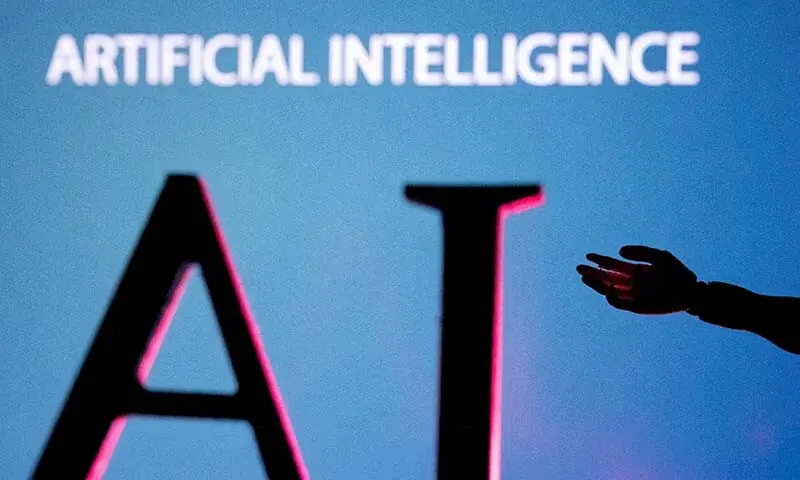 AI (Artificial Intelligence) letters and a robot hand miniature are seen in this illustration created on June 23, 2023. &mdash; Reuters/File