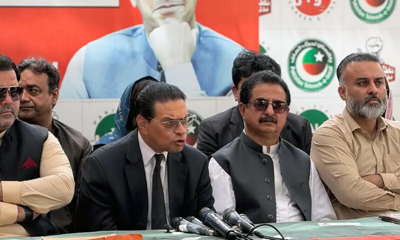 PTI leader Salman Akram Raja speaks as Haleem Adil Sheikh looks on.—PPI PTI leader Salman Akram Raja speaks as Haleem Adil Sheikh looks on.—PPI