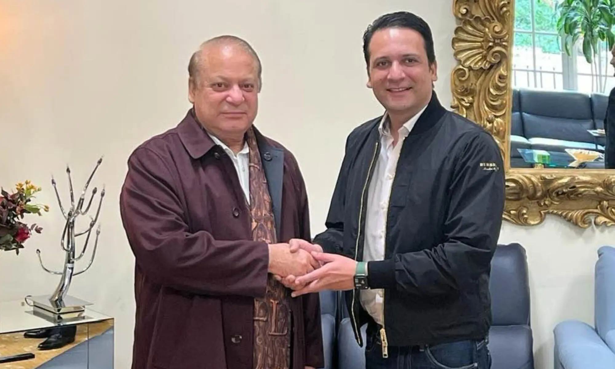 Barrister Iftikhar Ali Gillani shakes hands with PML-N President Nawaz Sharif. &mdash; Photo courtesy Iftikhar Gillani/Facebook