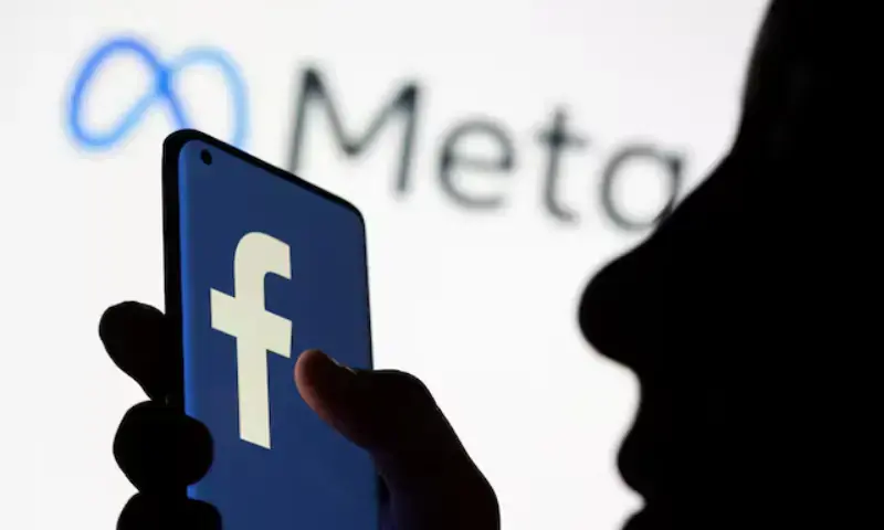 Woman holds smartphone with Facebook logo in front of a displayed logo for Meta in this illustration picture taken on October 28, 2021. — Reuters/File Photo Woman holds smartphone with Facebook logo in front of a displayed logo for Meta in this illustration picture taken on October 28, 2021. — Reuters/File Photo
