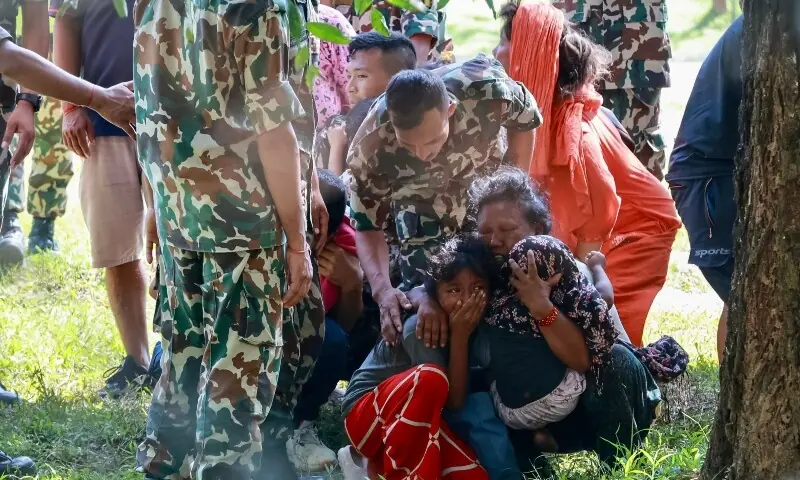 Rescued residents react as they meet family members at an army camp following flash floods, in Battar Bazar town of Nepal’s Nuwakot district on August 28, 2026. —AFP