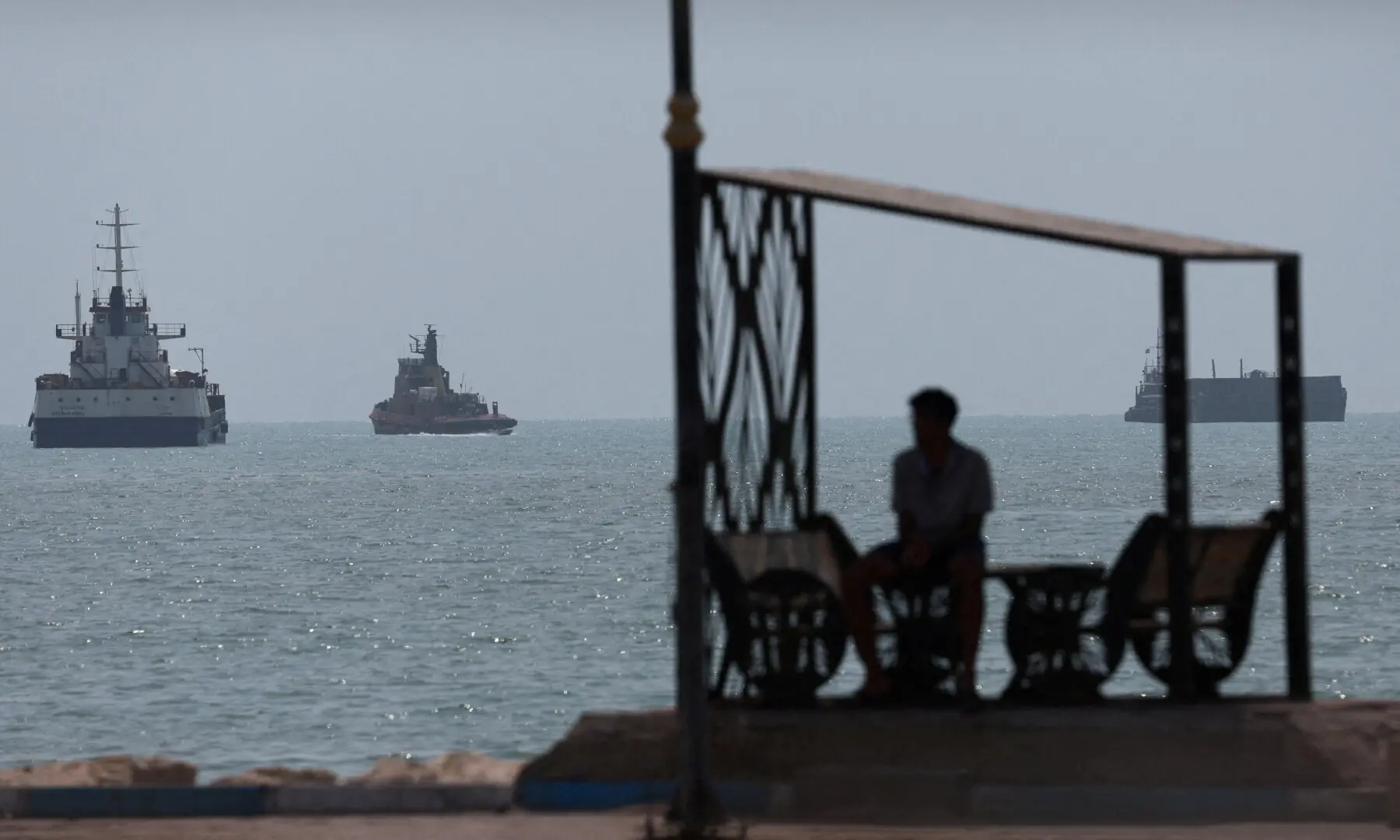 Vessels in the Strait of Hormuz are visible near the beach of Bandar Abbas, Iran on August 28, 2026. &mdash; Reuters