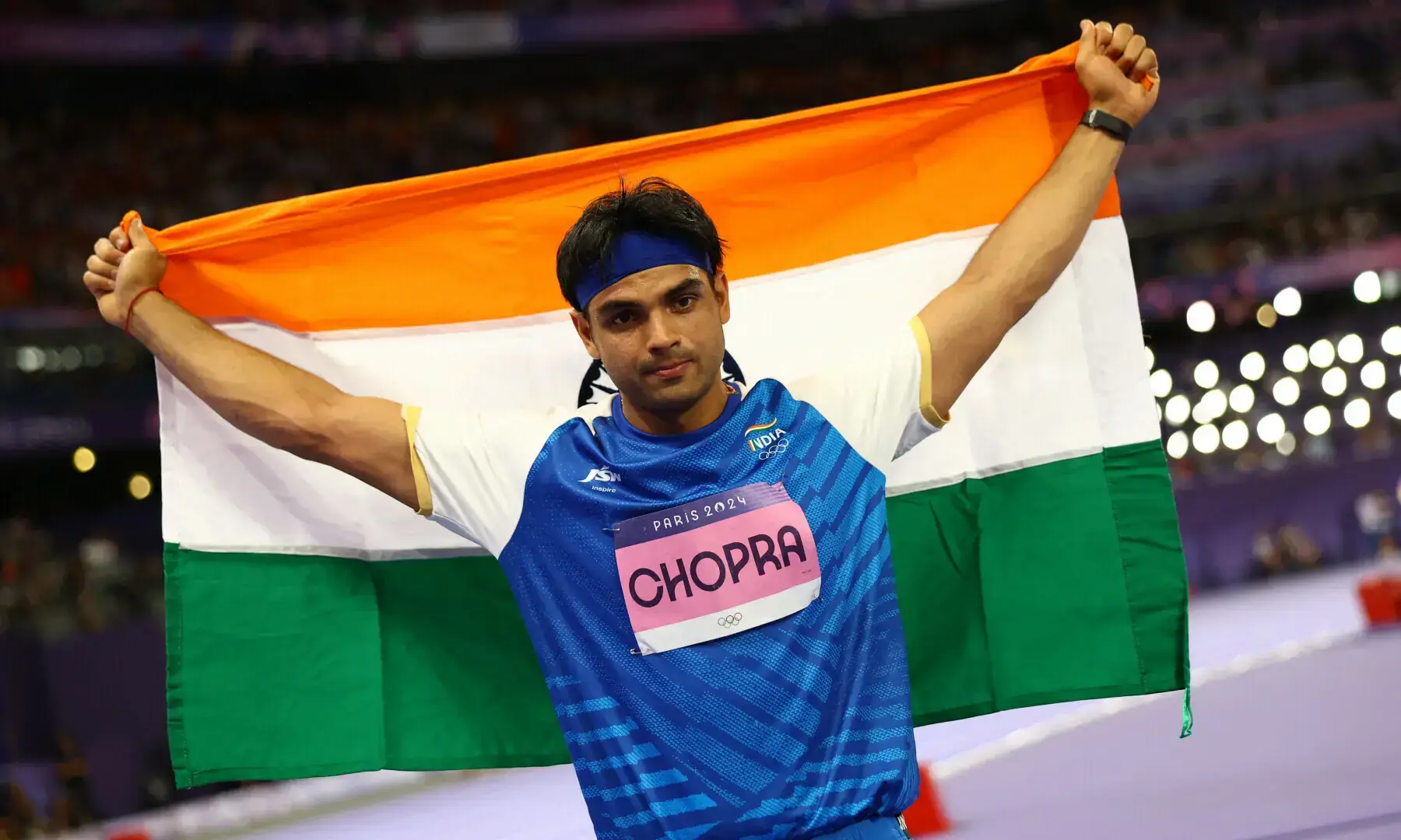 Neeraj Chopra of India celebrates with his national flag after winning silver at the Men's Javelin Throw Final at Stade de France, Saint-Denis, France on Aug 8, 2024. — Reuters/File Neeraj Chopra of India celebrates with his national flag after winning silver at the Men's Javelin Throw Final at Stade de France, Saint-Denis, France on Aug 8, 2024. — Reuters/File