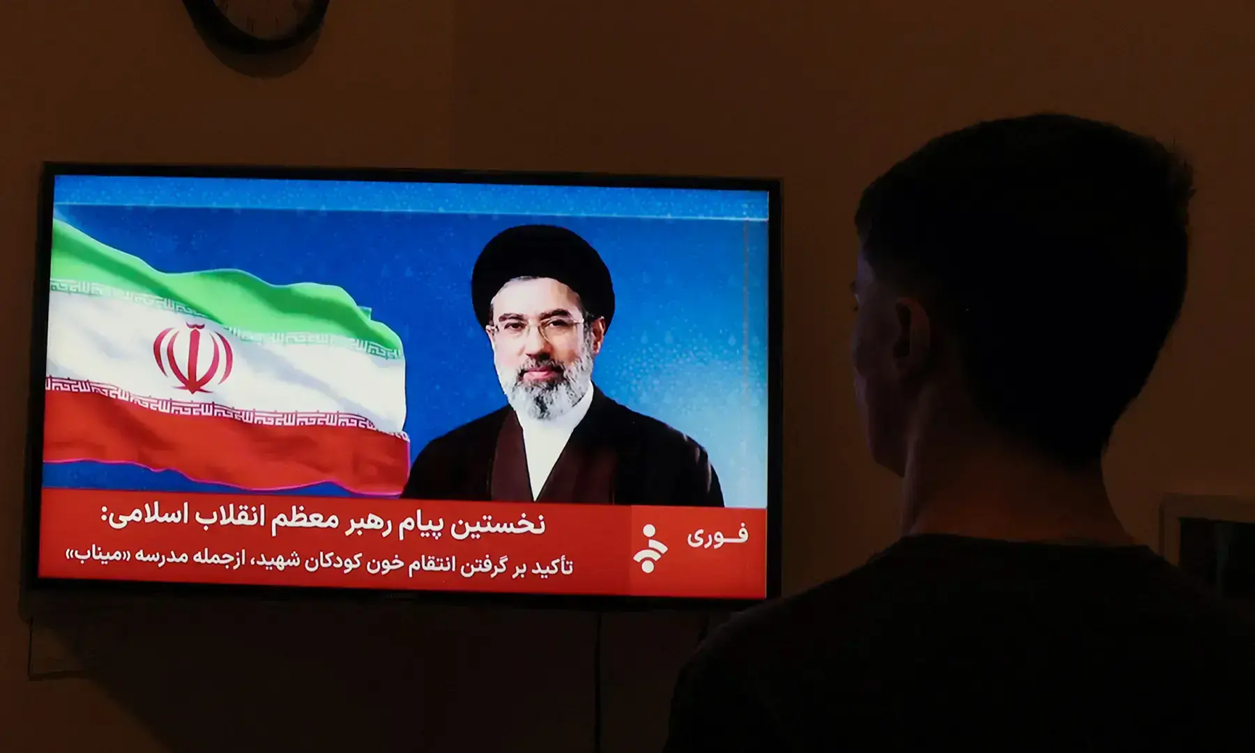 A man watches a televised statement by Iran's supreme leader Mojtaba Khamenei on March 12. &mdash; AFP/File