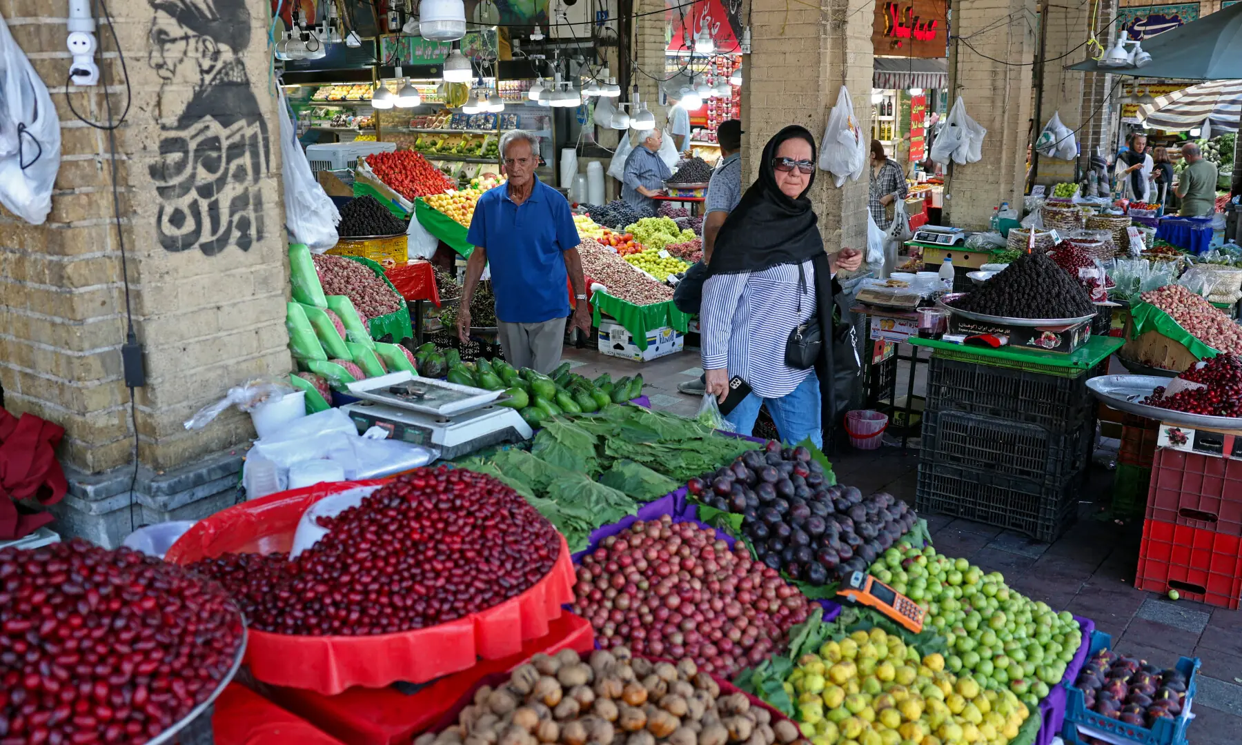 People shop for produce at the historic Tajrish bazaar in northern Tehran, on Aug 25, 2026. &mdash; AFP