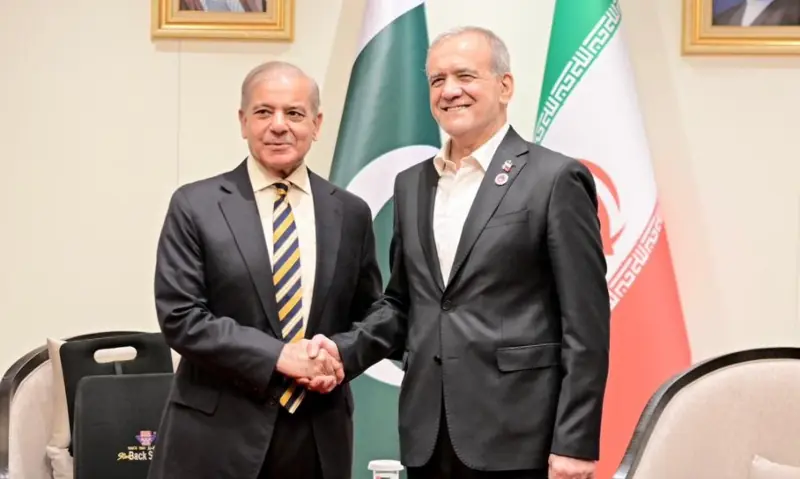 Prime Minister Shehbaz Sharif shakes hands with Iranian President Masoud Pezeshkian on the sidelines of the SCO Council of Heads of State meeting in Bishkek, Kyrgyzstan on Aug 31. &mdash; X/PakPMO