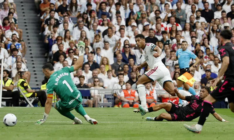 MADRID: Real Madrid’s Jude Bellingham (second L) scores past Malaga goalkeeper Alfonso Herrero during their La Liga match at Santiago Bernabeu.—Reuters MADRID: Real Madrid’s Jude Bellingham (second L) scores past Malaga goalkeeper Alfonso Herrero during their La Liga match at Santiago Bernabeu.—Reuters