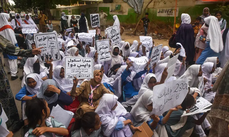 Students stage a sit-in outside the Delhi Government School, demanding the immediate unsealing of the building and resumption of classes.&mdash;Fahim Siddiqi / White Star