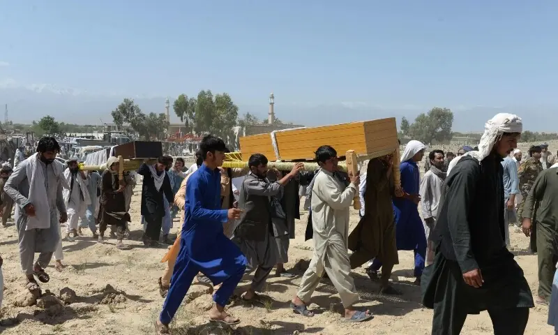 Afghan mourners carry the coffin of one of the nine people killed during an overnight raid by Afghan forces at Chaparhar district on the outskirts of Jalalabad in Nangarhar province on May 29, 2018. &mdash; AFP/File
