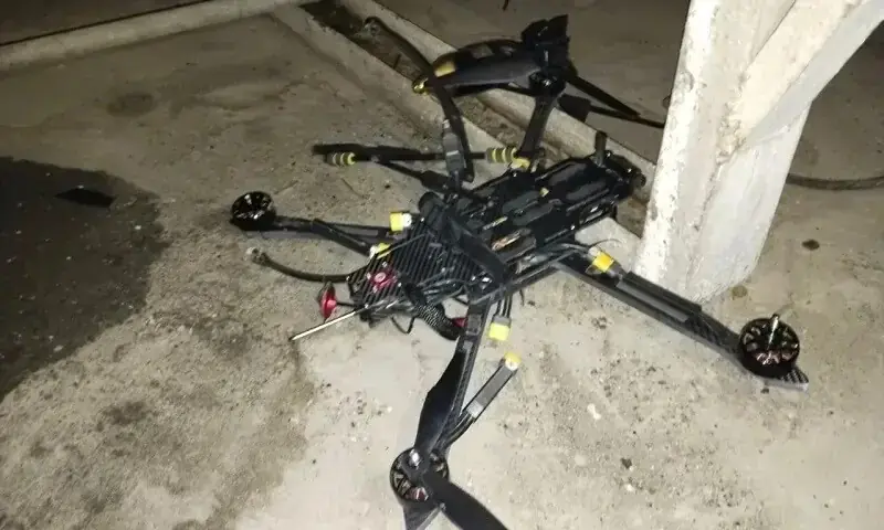 A quadcopter crashes on the roof of a house in Islamabad's Humak locality. &mdash; Photo by Munawar Azeem/File