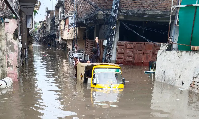A rickshaw is seen half-submerged on a road after heavy rains lashed Rawalpindi on September 1. — White Star A rickshaw is seen half-submerged on a road after heavy rains lashed Rawalpindi on September 1. — White Star