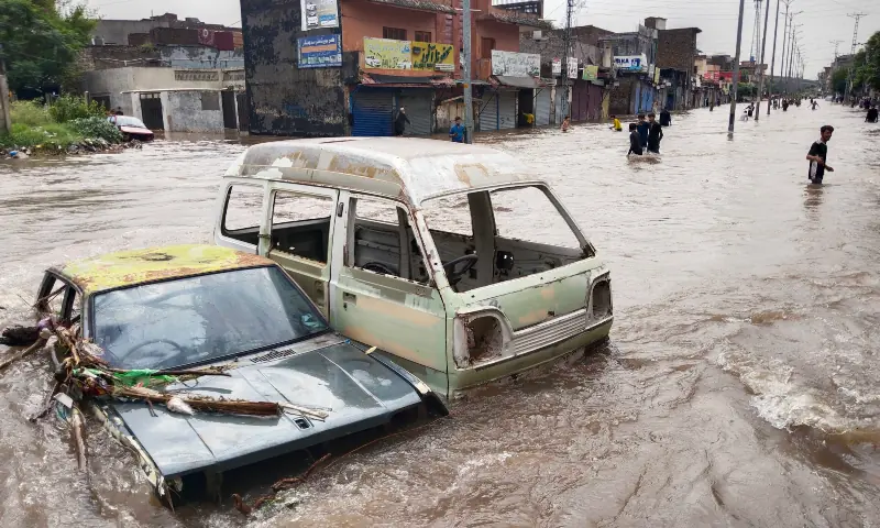 Abandoned vehicles are seen half-submerged on a road after heavy rains lashed Rawalpindi on September 1. — White Star Abandoned vehicles are seen half-submerged on a road after heavy rains lashed Rawalpindi on September 1. — White Star