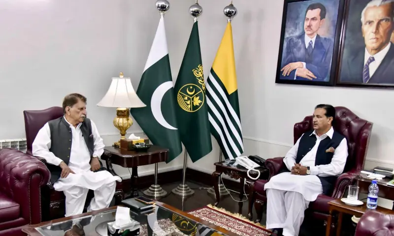 AJK former premier Raja Farooq Haider (left) calls on acting president Chaudhry Tariq Farooq on Thursday. Photo via author
