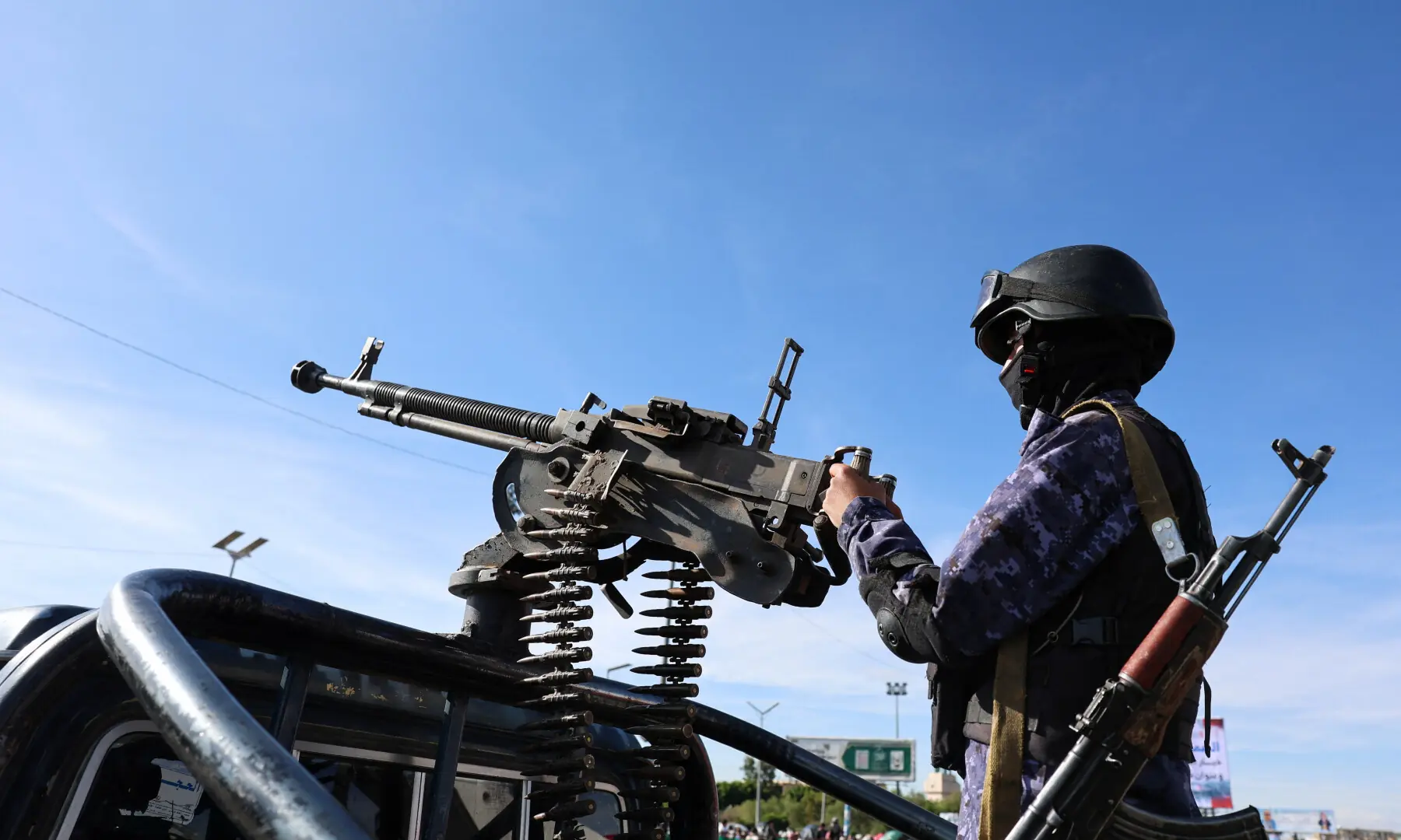 Houthi police trooper mans a machine gun mounted on a patrol vehicle at the site of a rally in solidarity with Iran, in Sanaa, Yemen, on March 27, 2026. &mdash; Reuters/File