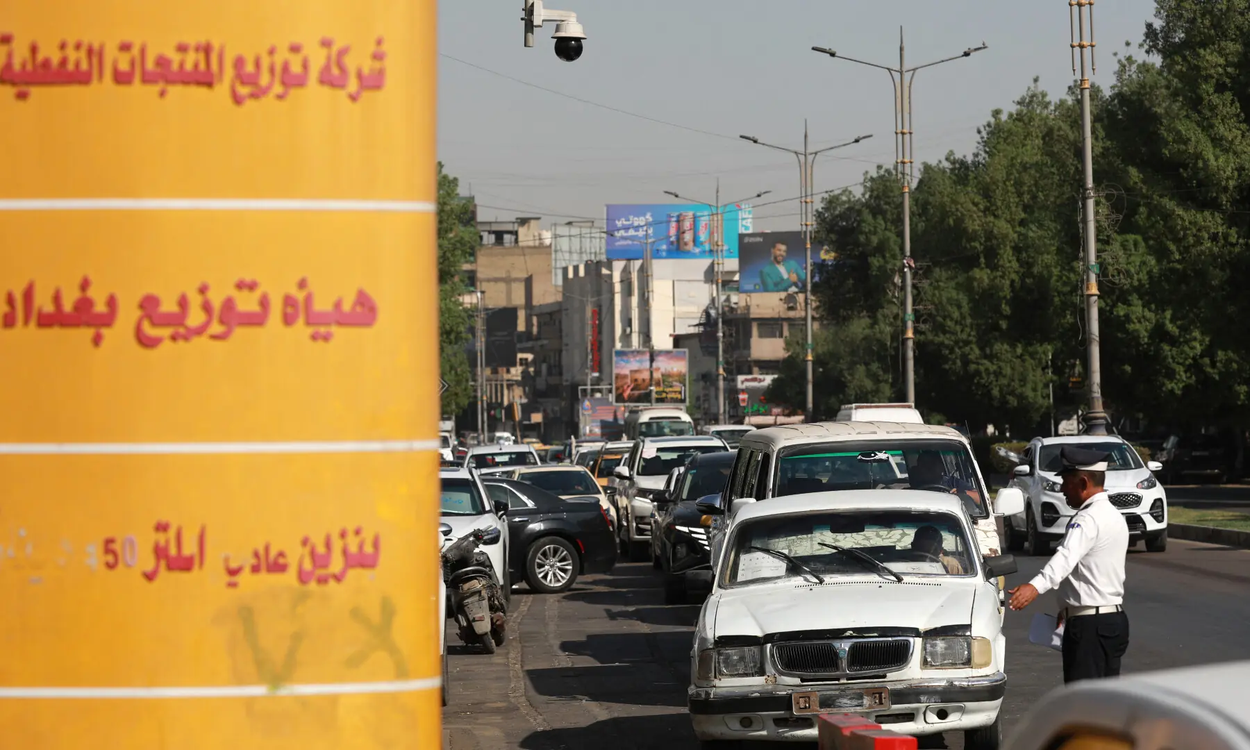 An Iraqi traffic police officer controls the queues at a petrol station in the Iraqi capital Baghdad on Sept 5, 2026. &mdash; AFP