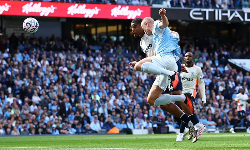 MANCHESTER: Erling Haaland (front) of Manchester City heads to score against Coventry City during their Premier League match at the Etihad Stadium on Saturday.—Reuters MANCHESTER: Erling Haaland (front) of Manchester City heads to score against Coventry City during their Premier League match at the Etihad Stadium on Saturday.—Reuters