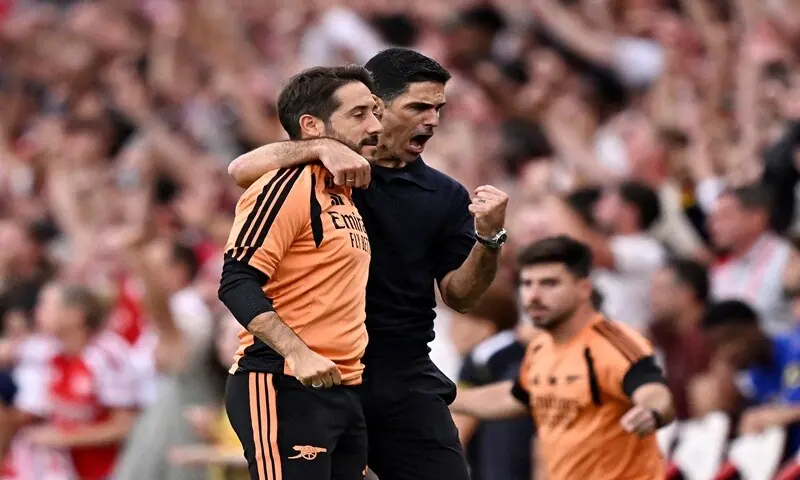 Arsenal manager Mikel Arteta (R) celebrates with set-piece coach Nicolas Jover after the Premier League match against Chelsea at the Emirates Stadium in London on September 6, 2026. &mdash;Reuters