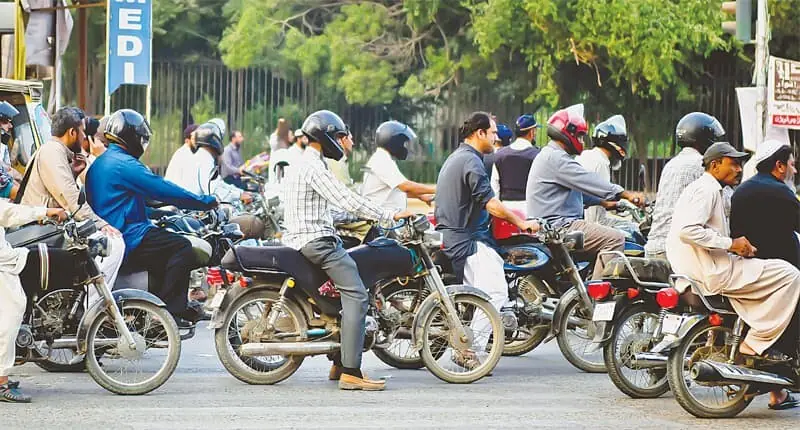 DUE to the lack of a proper public transport system, the city’s roads are swamped by motorbikes.—Fahim Siddiqi / White Star/File DUE to the lack of a proper public transport system, the city’s roads are swamped by motorbikes.—Fahim Siddiqi / White Star/File