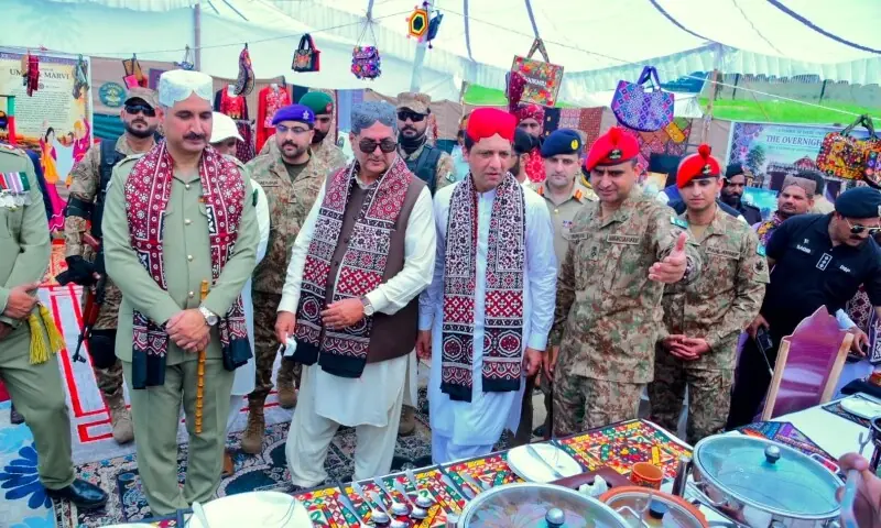 Wearing traditional Sindhi ajrak and caps, AJK Acting President Tariq Farooq, Prime Minister Iftikhar Gillani and GOC Chinar Division Maj-Gen Zarrar Mehmood inspect a food stall at an exhibition in Muzaffarabad on Sunday, held as part of Defence Day celebrations. —Photo by Tariq Naqash Wearing traditional Sindhi ajrak and caps, AJK Acting President Tariq Farooq, Prime Minister Iftikhar Gillani and GOC Chinar Division Maj-Gen Zarrar Mehmood inspect a food stall at an exhibition in Muzaffarabad on Sunday, held as part of Defence Day celebrations. —Photo by Tariq Naqash