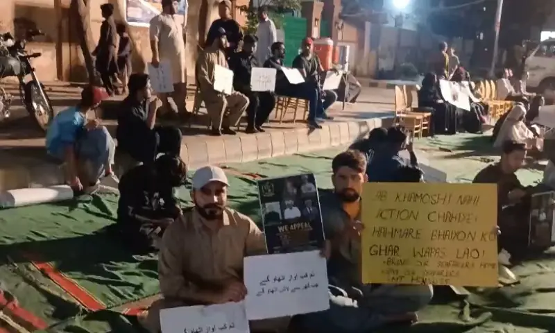 Families of the hostages aboard the MT Honour 25 at the late-night sit-in near Karachi's Sharea Faisal on September 6. &mdash; Screengrab from video via author