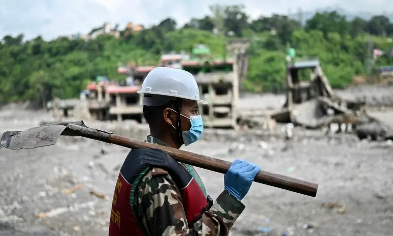 An army personnel conducts a search and rescue operation in the aftermath of flash floods at Trishuli in Nepal&rsquo;s Nuwakot district on September 7. &mdash; AFP