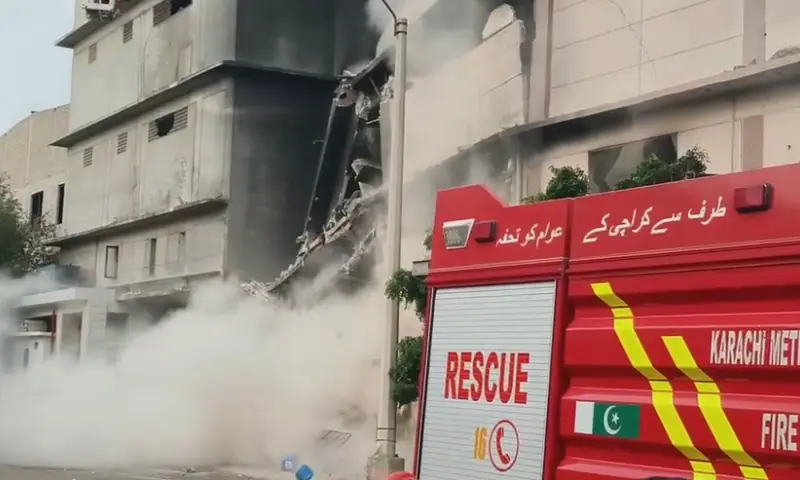 Screengrab from a video shows part of a building collapsing after a fire in Karachi's Landhi area on Sept 7, 2026. &mdash; Courtesy of Rescue 1122