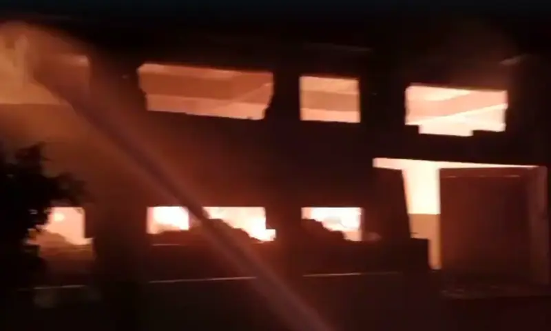 Screengrab from a video shows part of a building collapsing after a fire in Karachi's Landhi area on Sept 7, 2026. &mdash; Courtesy of Rescue 1122
