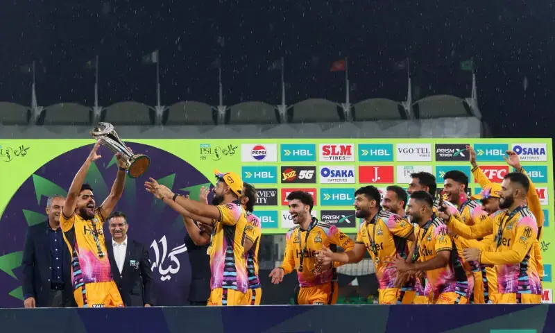 Peshawar Zalmi's captain Babar Azam, lifting the HBL PSL 11 trophy after the final match in Lahore on May 3, 2026. &mdash; Photo via X/@thePSLt20