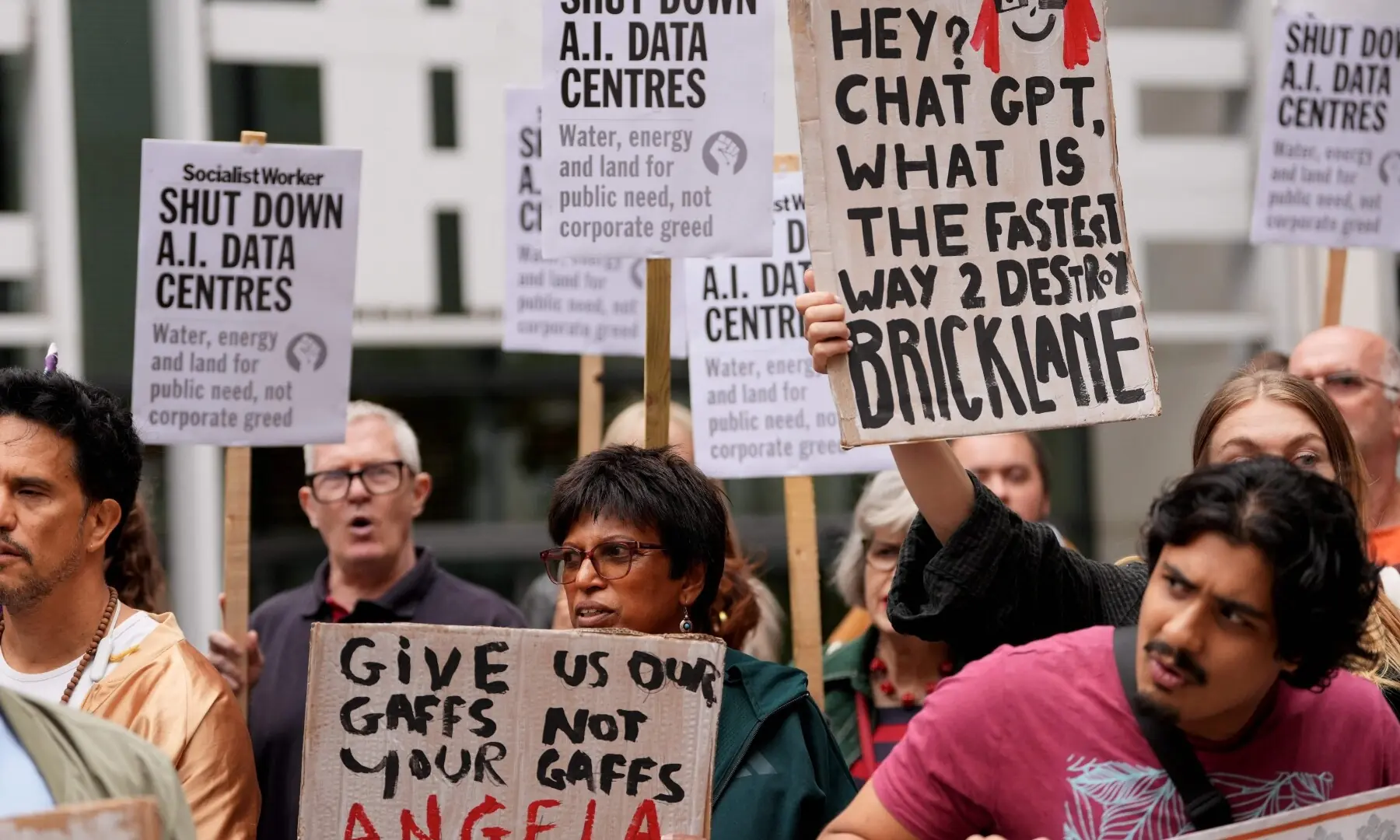 This photo taken on September 4, 2026 shows people holding placards against the approval of a data centre in the government’s redevelopment plans for Brick Lane, outside the Ministry of Housing offices in London. —AFP