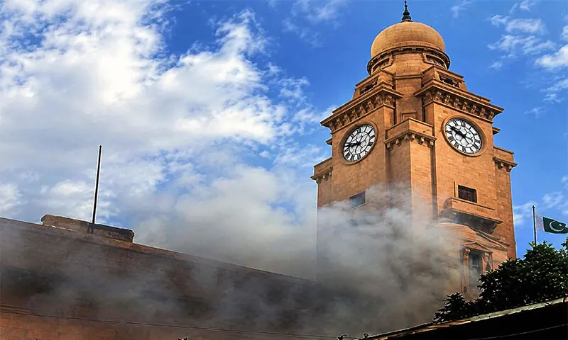 Smoke billows from the first floor of the historic KMC building after fire erupted in the Karachi mayor&rsquo;s office.&mdash;PPI