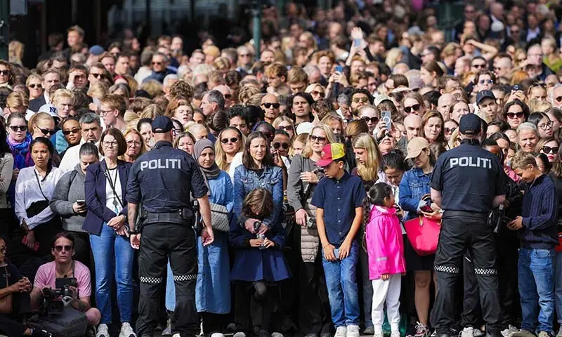 Mourners watch as the casket of late King Harald V of Norway is transferred during a royal procession from the Royal Palace Chapel to the Cathedral in Oslo, Norway on September 9, 2026. &mdash; AFP