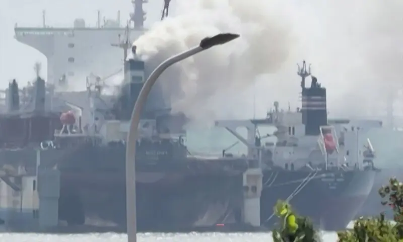 This screengrab from video taken on September 10, 2026 and provided by Qingdao WoLin Packaging shows smoke rising from a cargo ship at a port in Qingdao in eastern China. — AFP This screengrab from video taken on September 10, 2026 and provided by Qingdao WoLin Packaging shows smoke rising from a cargo ship at a port in Qingdao in eastern China. — AFP