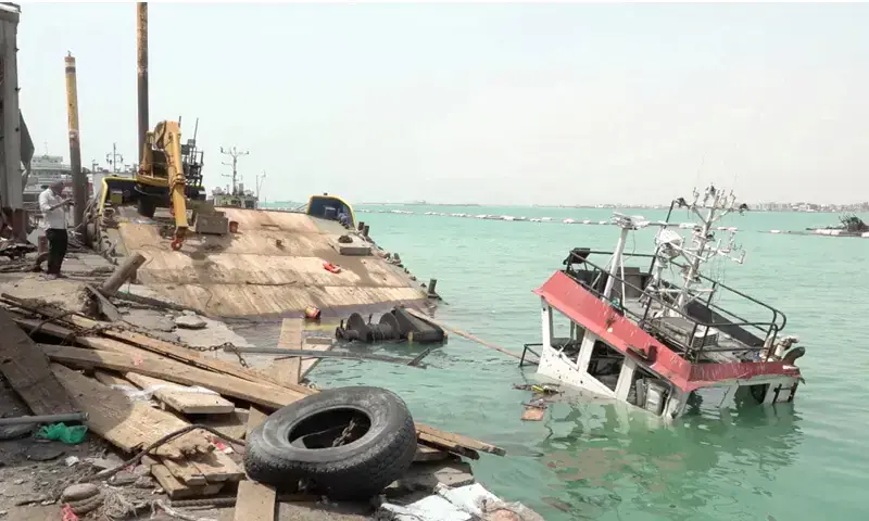 THE wreckage of a boat damaged by Houthi strikes is seen at the harbour, in the Red Sea port city of Mocha.—Reuters THE wreckage of a boat damaged by Houthi strikes is seen at the harbour, in the Red Sea port city of Mocha.—Reuters