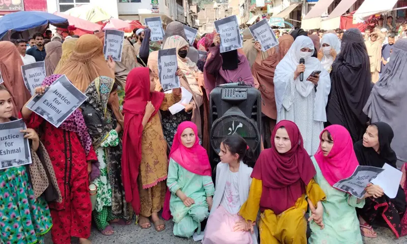 Women and children participate in a protest in Madyan Bazaar, Swat. &mdash; Dawn