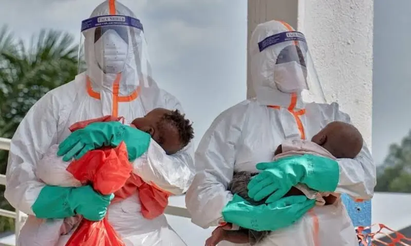 Congolese medical workers dressed in personal protective equipment (PPE) carry children tested and cleared off from Ebola from Saint Nicholas orphanage, at the Centre Medical Evangelique (CME) within the secured Ebola response zone, Sep 10. ---AFP Congolese medical workers dressed in personal protective equipment (PPE) carry children tested and cleared off from Ebola from Saint Nicholas orphanage, at the Centre Medical Evangelique (CME) within the secured Ebola response zone, Sep 10. ---AFP